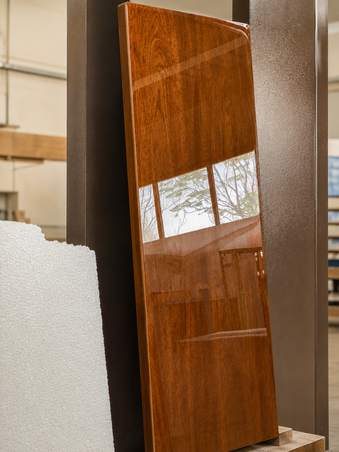 Mirror-gloss finished panel protected in foam padding ahead of crating for international freight